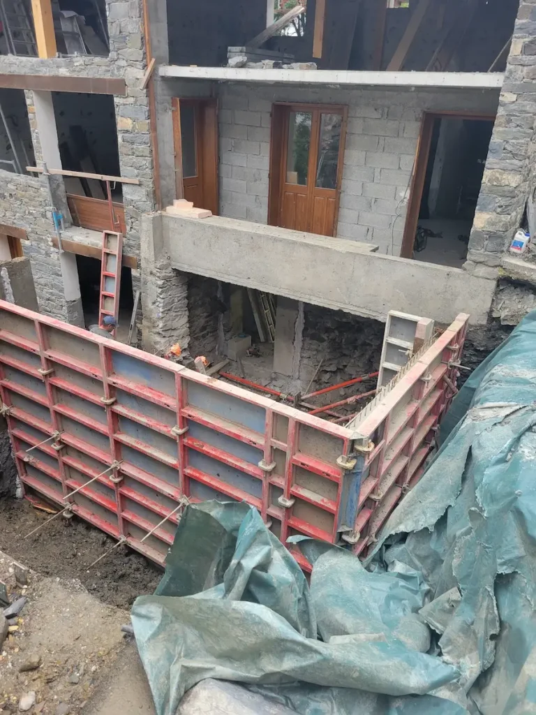 Concrete balcony construction at Chalet La Grange Timber roof framing at Chalet La Grange